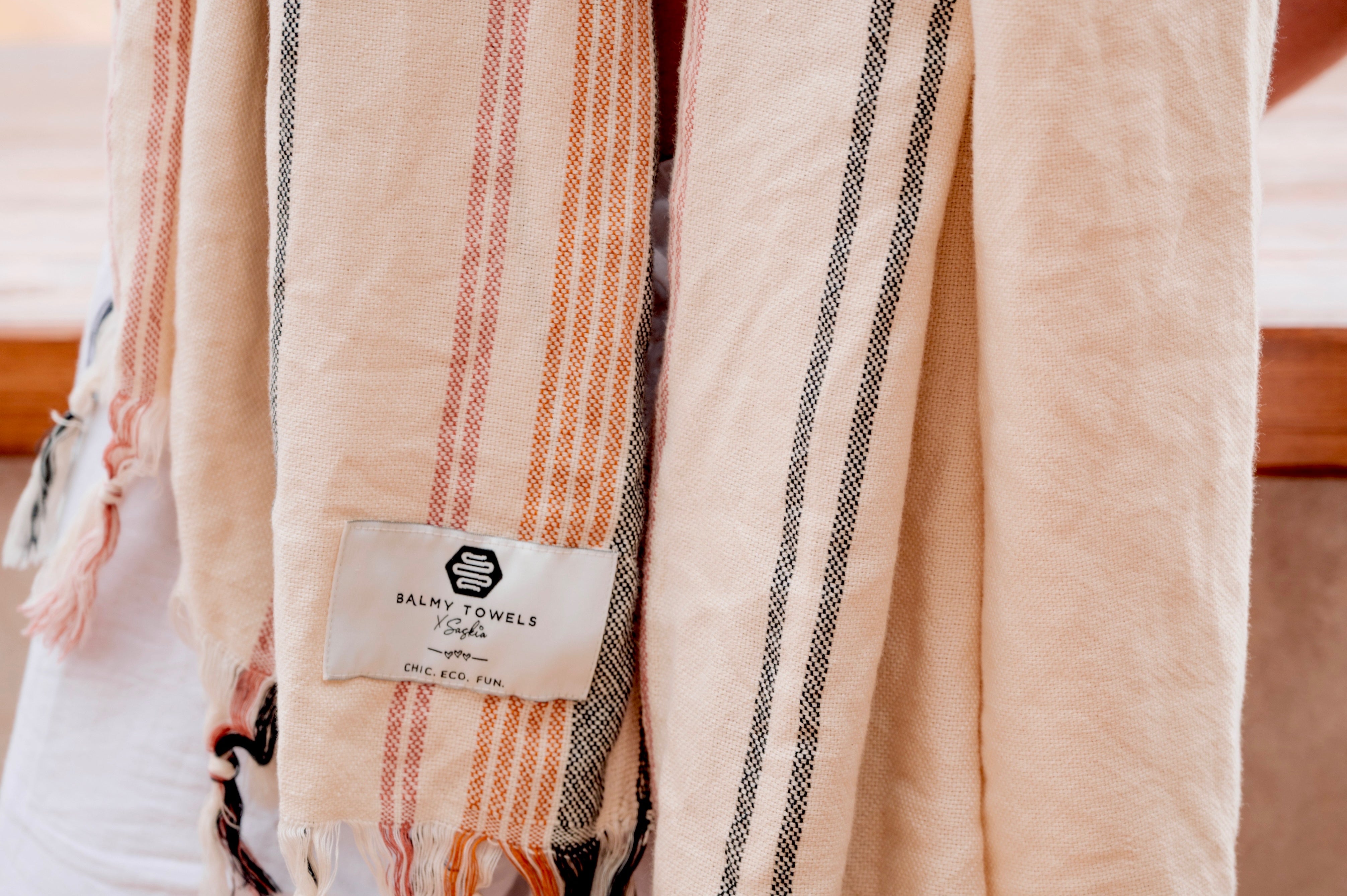 Close-up of NOA towel texture with Balmy label, handwoven cotton