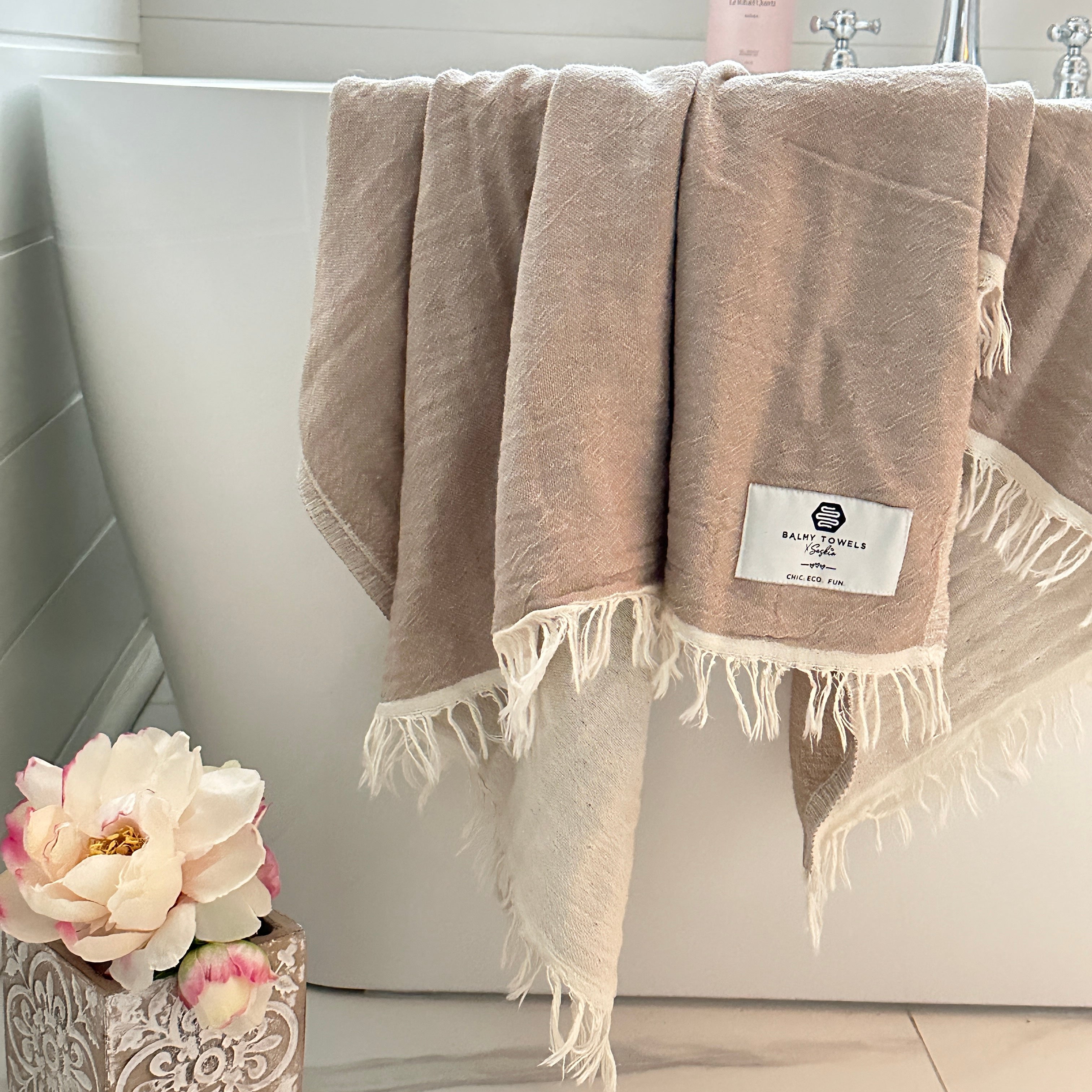 Napoli Towel stone beige on the side of the bathtub