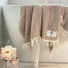 Napoli Towel stone beige on the side of the bathtub