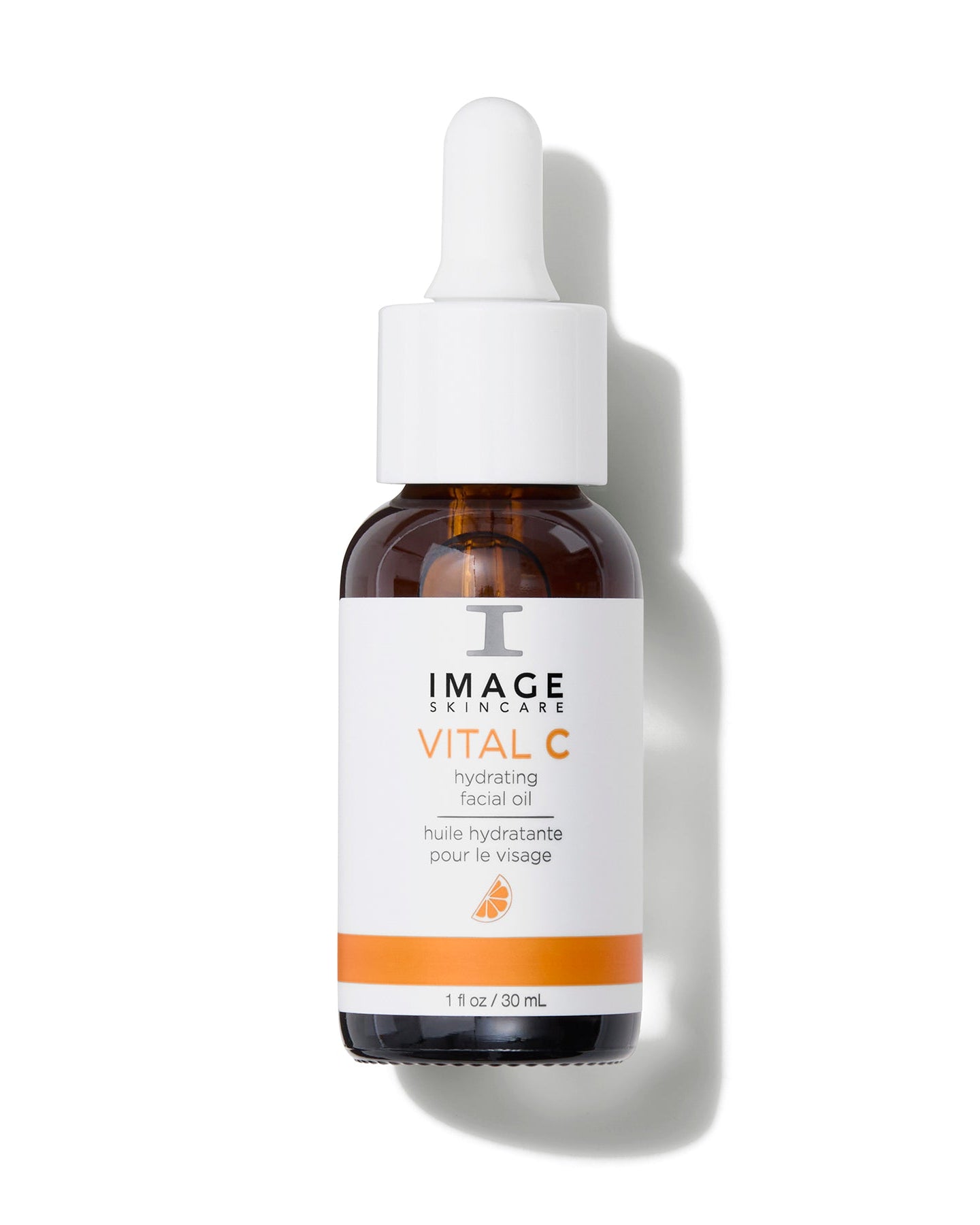 Flacon compte-gouttes ambré à étiquette blanche et orange, huile hydratante pour le visage VITAL C d’Image Skincare, 30 ml