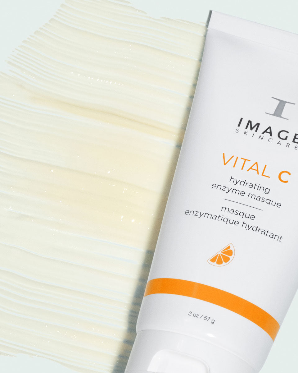 White and orange tube, Image Skincare VITAL C hydrating enzyme masque, beside a wide swatch of creamy texture