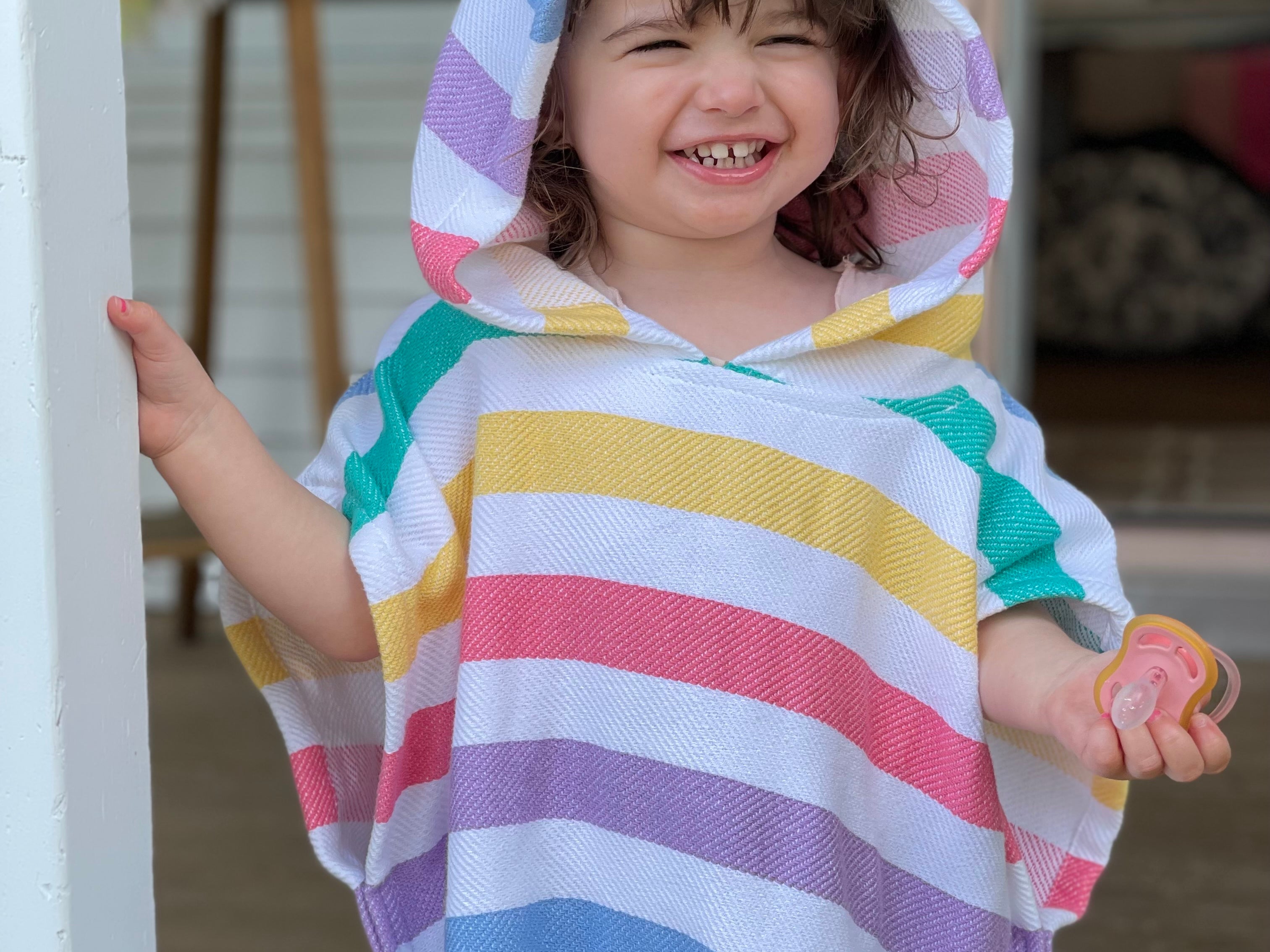 Softness, comfort & colours. The perfect poncho to follow your little ones from home to pool.