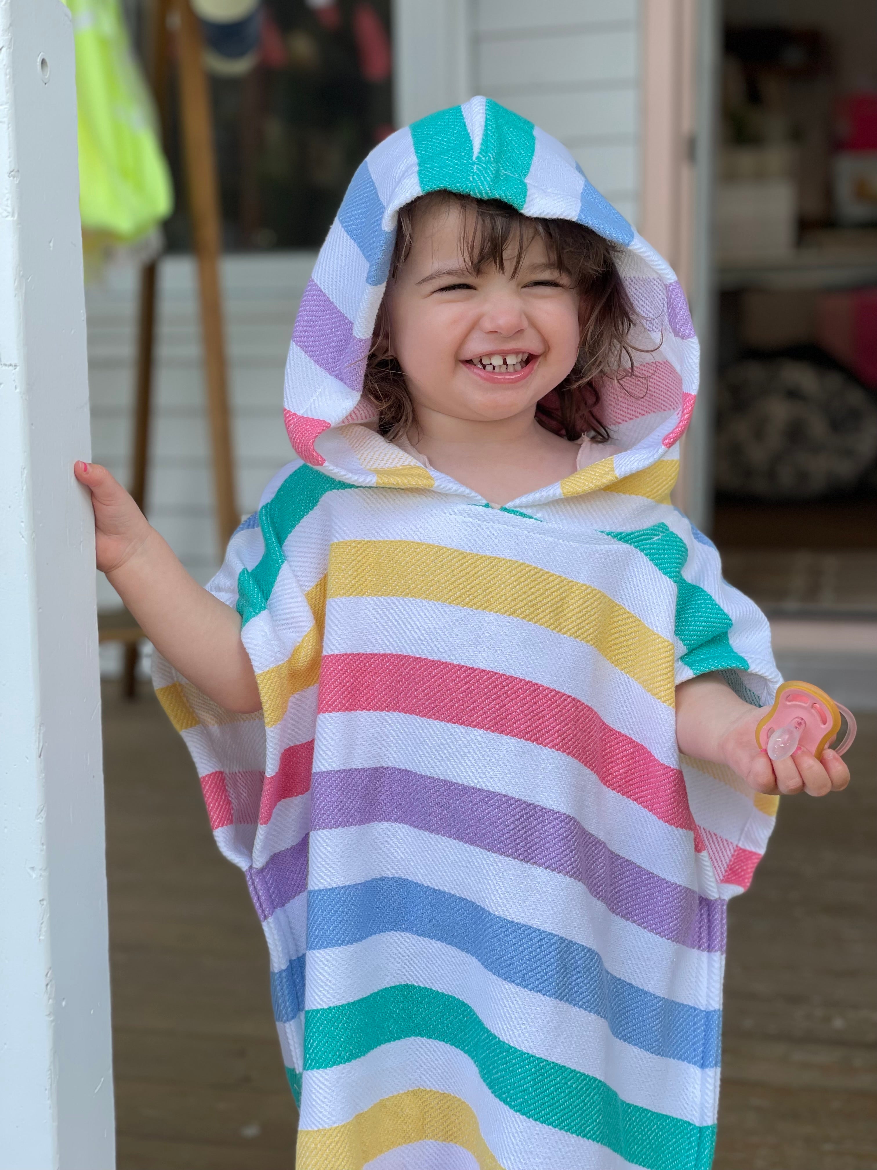 Softness, comfort & colours. The perfect poncho to follow your little ones from home to pool.